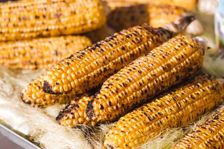 Hot and flavorful grilled corn close up. Asian street food