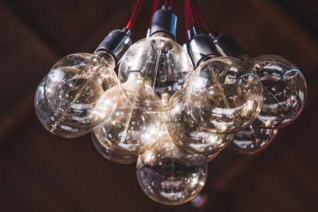 Decorative transparent glass chandelier in tcafe from many bulbsの写真素材