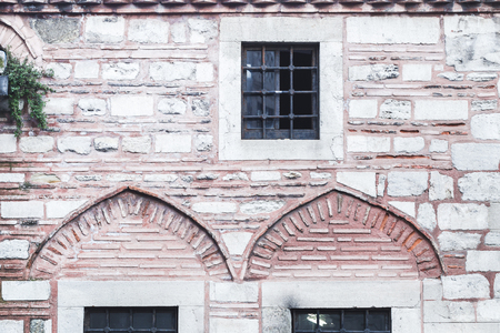 Beautiful stone and bricks facades with different sizes windows in Turkey Istanbulの写真素材