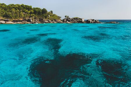 Sea bay with clear emerald water. Idyllic place for snorkelling and diving in Maldivesの写真素材