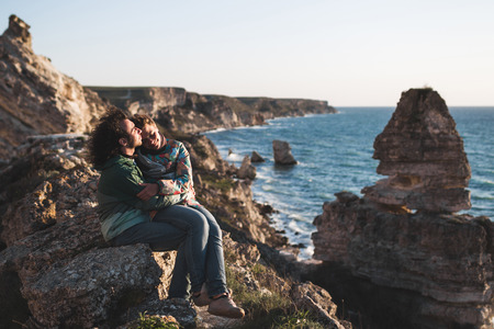 Guy and girl relaxing on the seaside with amazing view together. Outdoor walkingの写真素材