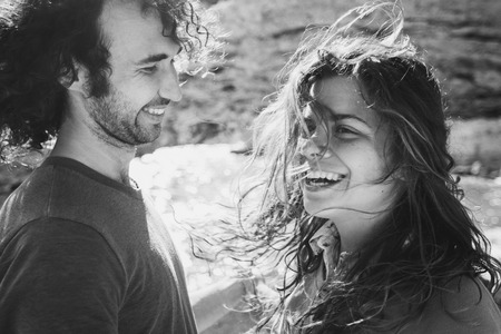 Lovely couple having fun in sunlight. Long curly hair, happiness and pleasureの写真素材