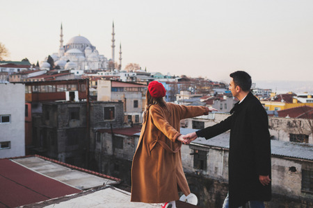 Couple in love walking on the roof of Grand Bazaar in old city Istanbulの写真素材