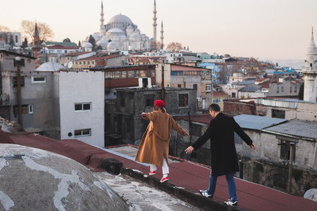 Couple in love walking on the roof of Grand Bazaar in old city Istanbulの写真素材