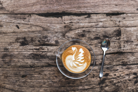 Cup of aroma cappuccino on wooden textured background, empty space for text, flat layの写真素材
