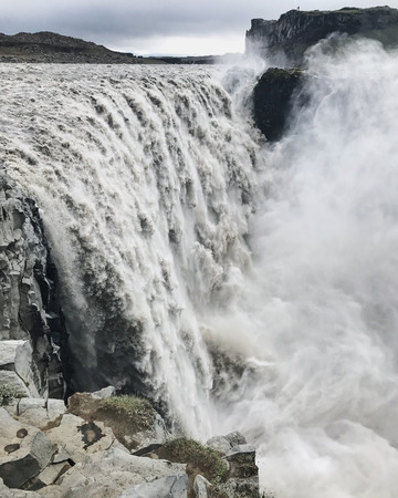 Detifoss waterfall in Iceland in misty and rainy weather in highlands. Famous place of Iceland, The most powerful waterfall in Europeの写真素材