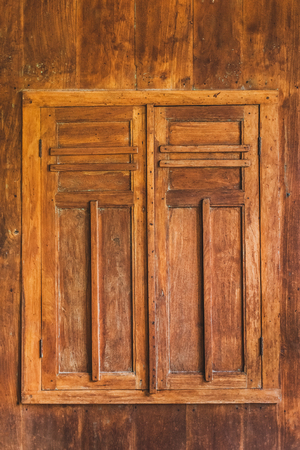 Closed wooden window with shuttersの写真素材