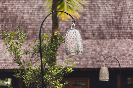 Beautiful street lantern in bali tropical garden. Metal and silver colored, forged and handmadeの写真素材