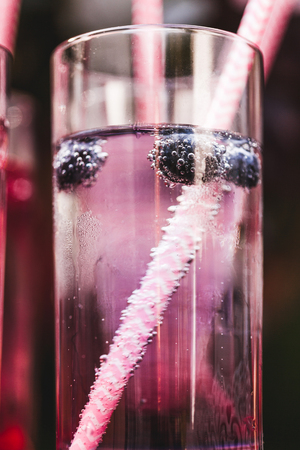 Various cold fresh drinks, berries lemonade closeup on wedding receptionの写真素材