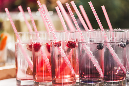 Various cold fresh drinks, berries lemonade closeup on wedding receptionの写真素材