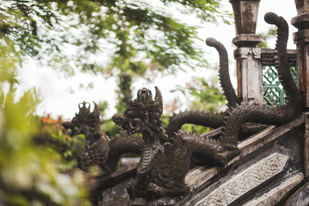 Tirta Gangga Balinese architecture, traditional statue of deity in dragon shapeの写真素材