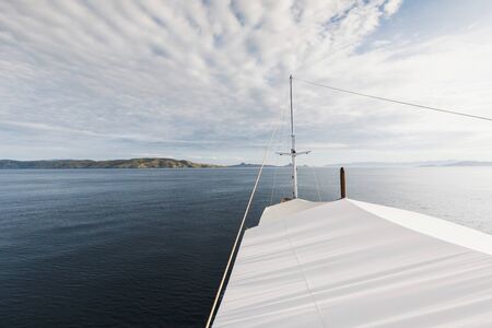 View from luxury white yacht in sea. Blue sky, day light. Travel and cruise background with empty place.の写真素材