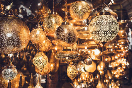 Traditional moroccan souvenir lamps on local market souk in Marrakesh medina. Handmade work, different shapes.の写真素材