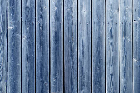 wooden fence of blue-colored boardsの写真素材