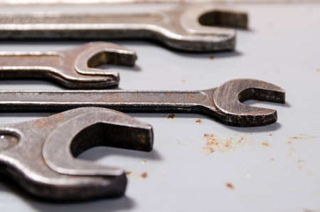 several wrenches on the background of metal painted platesの写真素材
