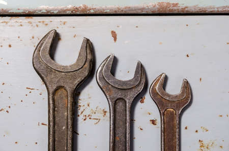 several wrenches on the background of metal painted platesの写真素材