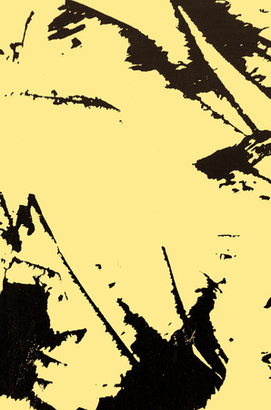 A metal sheet covered with yellow paint scratchedの写真素材