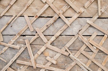 old grunge wall of planks with wooden lathing without stucco. vintage.