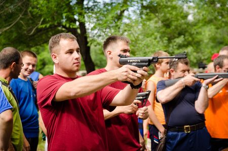 KOMSOMOLSK-ON-AMUR, RUSSIA, AUGUST 1, 2015. Railroader's day. The shooting competition for men in the amateur category. a man shoot from pneumatic pistol in competition.

のeditorial素材