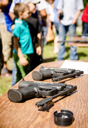 KOMSOMOLSK-ON-AMUR, RUSSIA, AUGUST 1, 2015. Public open Railroader's day. two pneumatically discharged pistols lie on the table in amateur competition. close upのeditorial素材