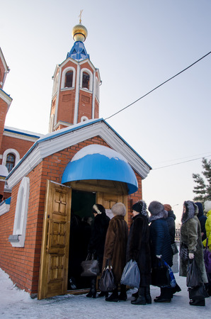 Komsomolsk-on-Amur, Russia - January 19, 2018. Public open. Cathedral of the Kazan Icon of the Mother of God, Epiphany. People came for the blessed water.のeditorial素材