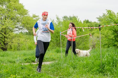 Komsomolsk-on-Amur, RUSSIA - JUNE 2, 2019. woman an athlete runs on the track at running competitionのeditorial素材
