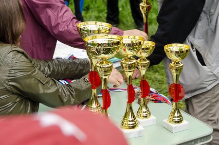 Komsomolsk-on-Amur, RUSSIA - JUNE 2, 2019. sports cups on the table of judges before awarding the winnersのeditorial素材