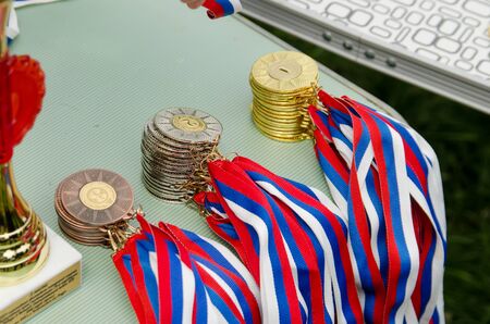 Komsomolsk-on-Amur, RUSSIA - JUNE 2, 2019. sports medals on the table of judges before awarding the winnersのeditorial素材