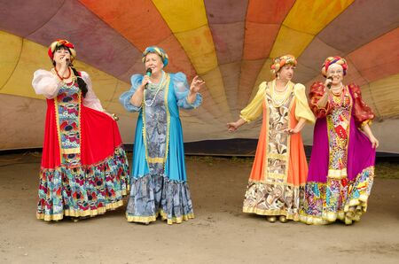 Komsomolsk-on-Amur, RUSSIA - SEPTEMBER 2, 2019. artists in bright festive Russian national costumes...