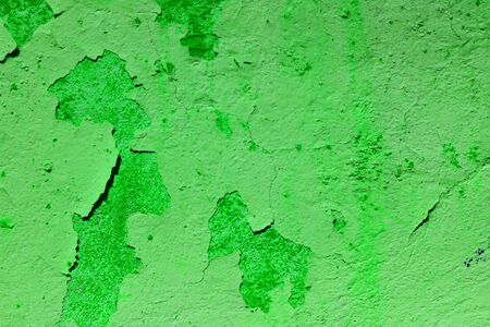 plastered aged weathered wall green color. grungy textured.の写真素材