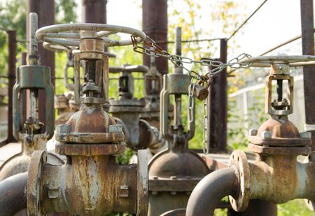 valves of water pipes with chain with a lock on it. protection against unauthorized access.
