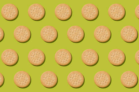 Pattern from biscuits on an olive background. Abstract background.
