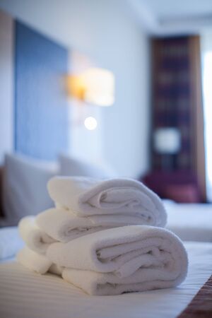 White towel on bed decoration in bedroom interior. Towel in Hotel Room , Welcome guests , Room serviceの写真素材