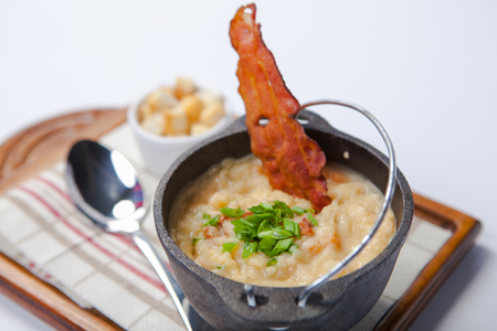Chowder with vegetables and mashed potatoes in a bowlの写真素材