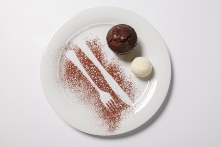 Lava cake with ice cream on a white plate. Isolatedの写真素材