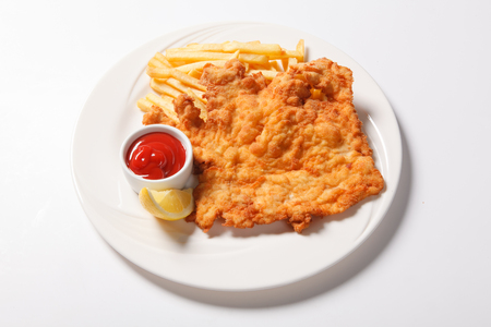 Fried fish and chips on the white plate. Isolatedの写真素材