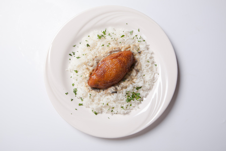 Cordon bleu with rice on a white plate. Isolatedの写真素材