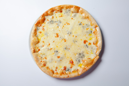 Italian delicious pizza with cheese on a white plate. White backgroundの写真素材