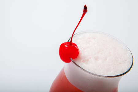 colourful coctail with cherry on the black background. Close upの写真素材