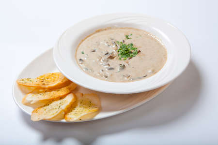 Mushroom cream soup with croutons, herbs and spices. Close upの写真素材