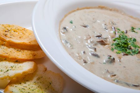 Mushroom cream soup with croutons, herbs and spices. Close upの写真素材