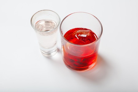 Vodka and a cocktail on a white background. Close upの写真素材