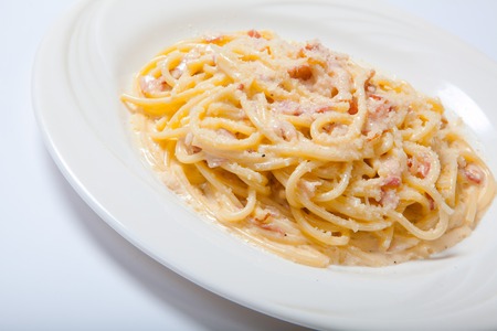 Pasta Carbonara with ham and cheese,Spaghetti Carbonara With Baked Ham And Parmesan Close Upの写真素材