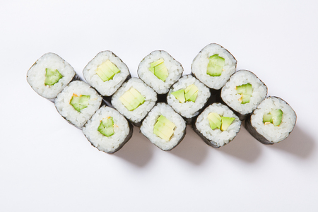 A plate with different kinds of sushi and rolls.の写真素材