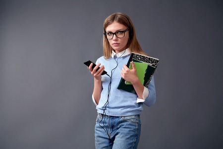Young beautiful woman with smart phone