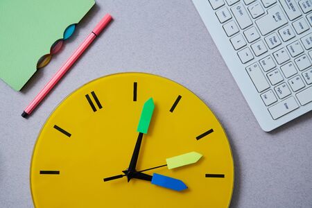 Time management deadline and schedule concept: clock, notebook and keyboard on grey background. Flat...