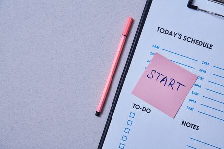 Time management deadline and schedule concept: schedule sheet and sticker with inscription on grey background.の写真素材