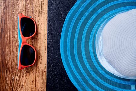 Adventure, travel or active and extreme vacation concept: women's wide brim hat and sunglasses.の写真素材