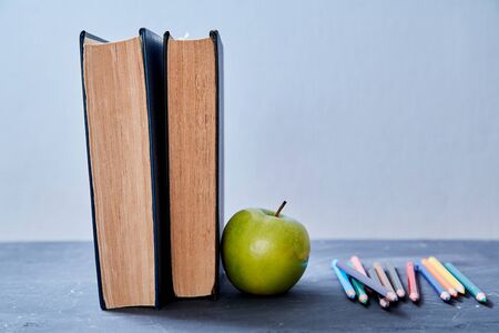 Back to school, college or student and education concept. Books, apple and accessories for school