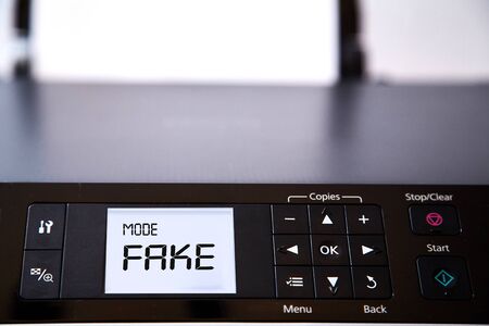 Fake news, disinformation or false information and propaganda concept. The printer screen that says
